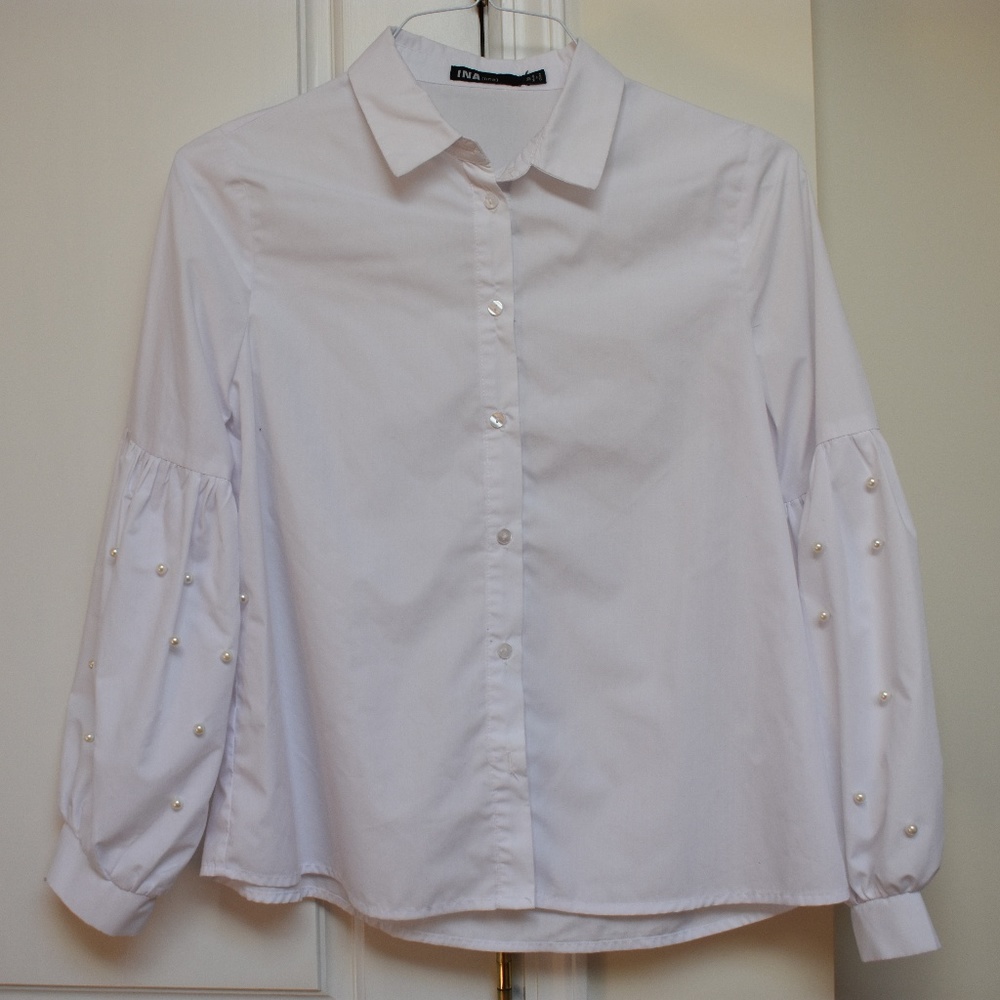 White button down shirt with puffy pearl sleeves